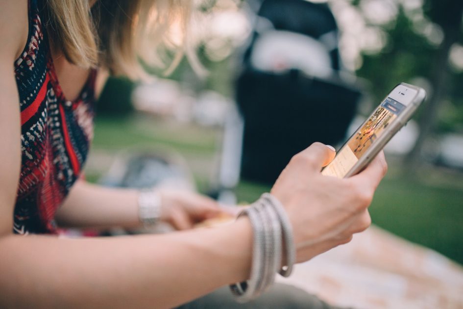 A-woman-using-smartphone-while-in-holiday