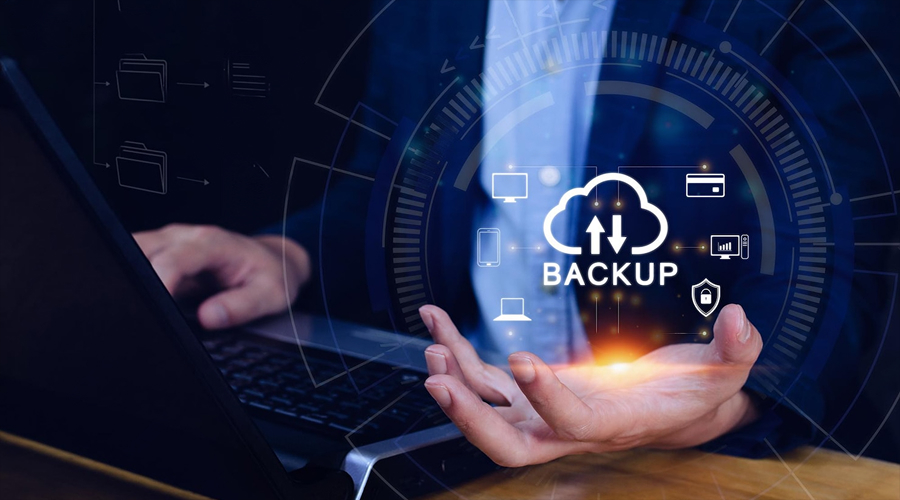 Backup Data and Test Those Backups - WeeTech Solution Pvt Ltd IT professional backing up company data to secure storage