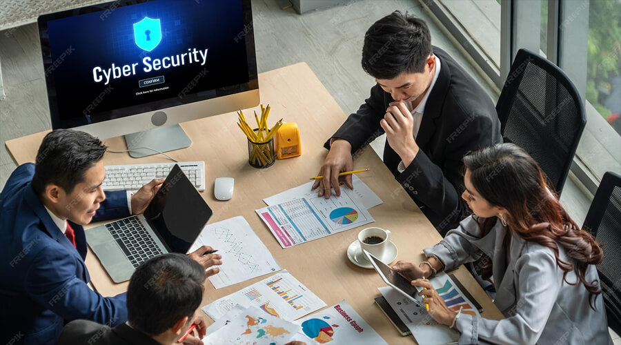 Make Cybersecurity a Company Culture - WeeTech Solution Pvt Ltd Employees collaborating with cybersecurity best practices integrated into company culture