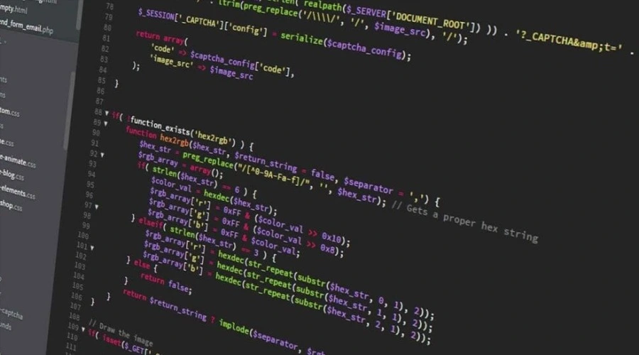 Write Code Faster More Efficiently - WeeTech Solution Pvt Ltd A close-up, angled view of colorful programming code on a dark screen.