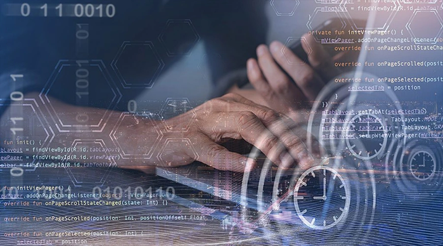 Enable Continuous Deployment - WeeTech Solution Pvt Ltd Hands typing on a laptop keyboard overlaid with digital programming code and clock icons.