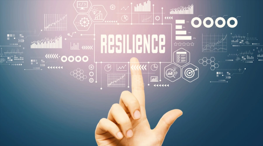 A hand pointing up to the word "RESILIENCE" surrounded by digital infographics, charts, and interface icons.
