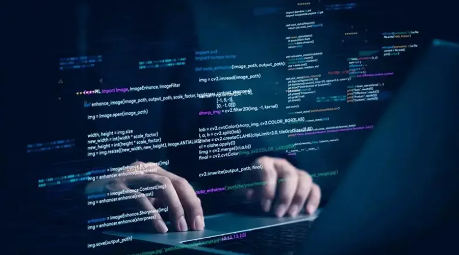 Customisation and Code Control - WeeTech Solution Pvt Ltd Hands typing on a laptop keyboard overlaid with colorful lines of digital code floating in 3D space.