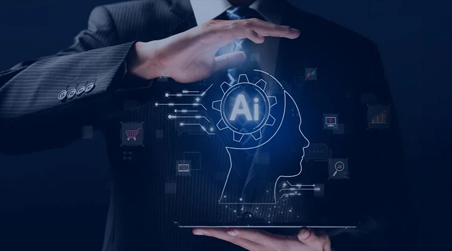 Production Readiness - WeeTech Solution Pvt Ltd Businessman in a dark suit gesturing with his hands around a glowing digital human head silhouette containing an "AI" gear icon.