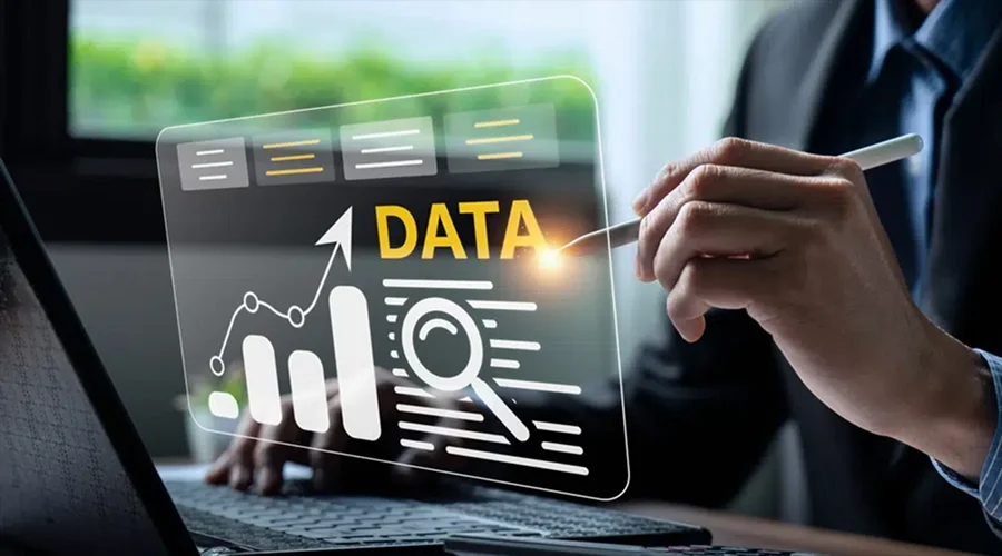 Business team collaborating at a desk overlaid with digital graphics representing quality assurance, network nodes, and system integration.