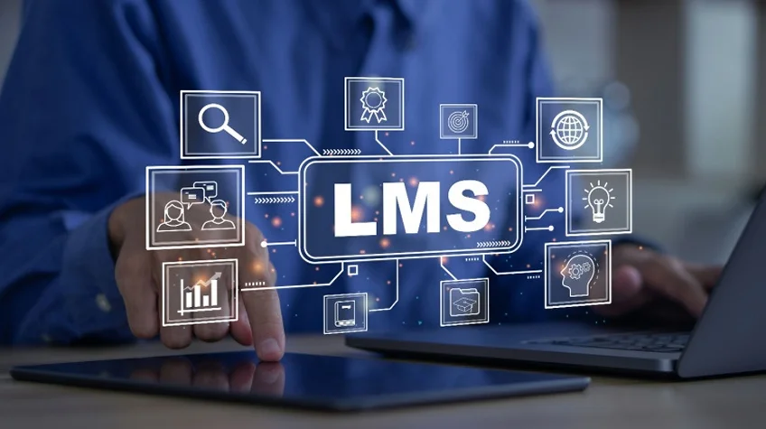 Best Tech Stack for Learning Management System (LMS) Development - WeeTech Solution Pvt Ltd Person using a tablet with a digital "LMS" network overlay.